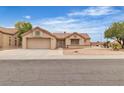 Street view of the home's front exterior featuring desert landscaping and a 2-car garage at 2532 Big Timber Dr, Las Vegas, NV 89134