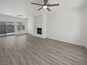 Spacious living room features neutral tones, modern flooring and a cozy fireplace at 3109 W Colton Ave, North Las Vegas, NV 89032