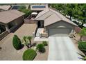 Aerial view of a single-story home with desert landscaping and a private backyard at 3307 Forestina Ct, Las Vegas, NV 89122
