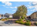 Charming home featuring mature landscaping and a paver driveway at 3782 Neblina Dr, Henderson, NV 89052