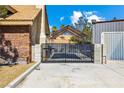 Backyard showing a gated area leading to a possible pool or recreational space at 3930 Maranatha Cir, Las Vegas, NV 89103