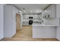 Bright kitchen with stainless steel appliances, sleek countertops, and ample white cabinetry at 3986 Belleville Ave, Las Vegas, NV 89121
