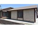 Street view of a charming stucco home with dark trim and a well-kept walkway at 4041 Saguaro Ln, Las Vegas, NV 89110