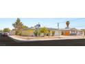 Street view of a cute home with solar panels, tidy landscaping and a single car garage at 4201 Sunrise Ave, Las Vegas, NV 89110