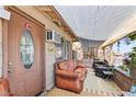 Comfortable covered porch with cushioned seating, offering a relaxing outdoor space at 4606 Powell Ave, Las Vegas, NV 89121