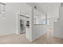 Open-concept living area with tile flooring, neutral color palette, and lots of natural light at 664 Peachy Canyon Cir # 103, Las Vegas, NV 89144