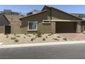 Inviting single-story home with low-maintenance landscaping and an attached garage at 901 Heritage Bend Dr, Las Vegas, NV 89138