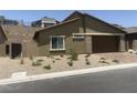 Cozy home featuring desert landscaping, an attached garage, and an inviting entrance at 901 Heritage Bend Dr, Las Vegas, NV 89138