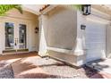 Close up of a home's front entrance with a double door and a two-car garage at 9500 Catalina Cove Cir, Las Vegas, NV 89147