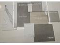 A collection of finish samples with hard flooring, tile, paint and carpet at 10266 Rosemont Hills St, Las Vegas, NV 89141