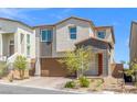 Charming two-story home featuring a well-kept front yard and a two car attached garage at 10776 Maltese Falcon Ave, Las Vegas, NV 89129