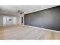 Spacious living room with neutral walls, recessed lighting and modern light wood flooring at 1641 K St, Las Vegas, NV 89106