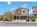 Attractive two-story home featuring a two-car garage and stone detailing, complemented by manicured landscaping at 176 Dunblane St, Henderson, NV 89012