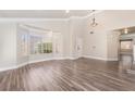 Large living room boasts a bright bay window and crown moulding throughout at 1804 Michael Ct, Henderson, NV 89014