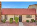 Charming townhouse with a red tile roof and well-maintained landscaping at 3907 Torsby Pl, Las Vegas, NV 89119