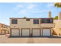 Townhome garages with upstairs living space and stucco exterior offer functionality and classic style at 5043 Spencer St # A, Las Vegas, NV 89119