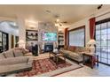 Comfortable living room with a stone fireplace and built-in shelves, creating a cozy atmosphere at 561 Carmel Valley St, Henderson, NV 89012