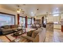 Spacious open-plan living area with living room, dining area and kitchen, perfect for entertaining at 561 Carmel Valley St, Henderson, NV 89012
