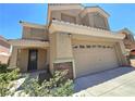 Charming home with a tidy yard, stone accents, and a welcoming entrance at 6638 Babys Tear Pl, Las Vegas, NV 89148