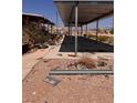 View of the carport and surrounding area at 7052 W Meranto Ave, Las Vegas, NV 89178