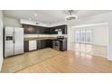 Features of the kitchen include stainless steel appliances and granite countertops with tile flooring at 882 Westminster Ave, Las Vegas, NV 89119