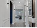 Bright hallway leading to living room with recessed lighting and stylish decorations at 9617 Sard Ln, Las Vegas, NV 89143
