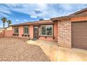 This single story home has three large picture windows and a 2-car garage at 1004 Woodside Ct, Henderson, NV 89015