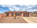 Charming single-story home with a well-maintained yard and inviting curb appeal at 1004 Woodside Ct, Henderson, NV 89015
