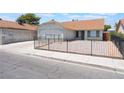 Attractive single-story home boasts a two-car garage and minimal landscaping, all enclosed by a secure fence at 1012 Greystone Dr, Las Vegas, NV 89108