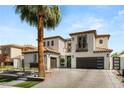 Inviting two-story home with tile roof, attached garages and modern design at 11453 Glowing Sunset Ln, Las Vegas, NV 89135