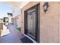 Close-up of an ornate, secure front door with decorative details and a welcoming entrance at 1319 Red Baron Ln, Boulder City, NV 89005