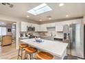 Well-lit kitchen with a skylight, stainless steel appliances and ample counter space at 1564 Vegas Valley Dr, Las Vegas, NV 89169