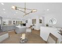 Bright dining area with open concept view of the kitchen, quartz countertops and pendant lighting at 2279 Keego Harbor St, Henderson, NV 89052