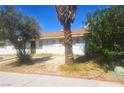 Nice single-story home with a tree-lined front yard and an inviting facade and mature trees at 4329 Studio St, Las Vegas, NV 89115