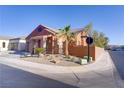 Corner lot featuring desert landscaping, a well-maintained lawn, and a charming exterior at 437 Via Stretto Ave, Henderson, NV 89011