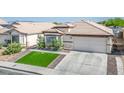 Attractive single-story home featuring a two-car garage, manicured lawn, and mature landscaping at 4529 Gracemont Ave, Las Vegas, NV 89139