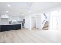 Bright and airy open-concept living space with white walls and hardwood floors at 5264 Silverheart Ave, Las Vegas, NV 89142