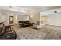Spacious living room with hardwood flooring, a ceiling fan, and a view to the front entryway at 667 Del Prado Dr, Boulder City, NV 89005