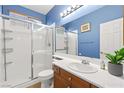 Clean bathroom with a shower over bath, single sink vanity with plenty of counter space at 7794 River Mist Ct, Las Vegas, NV 89113