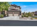 Charming two-story home with a spacious driveway and well-maintained desert landscaping at 7814 Granite City Ct, Las Vegas, NV 89166