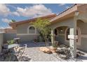 Enclosed courtyard with seating, decorative landscaping, and a charming outdoor space at 800 Antonio Dr, Las Vegas, NV 89107