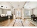 Elegant foyer featuring tile flooring, a double door entrance, and open access to office space at 8032 Audubon Canyon St, Las Vegas, NV 89131