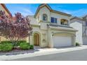 Charming two-story home with a well-maintained lawn and an attached two-car garage at 9225 Dalmahoy Pl, Las Vegas, NV 89145