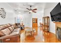 Bright living room with hardwood floors and fireplace at 930 High Plains Dr, Henderson, NV 89002
