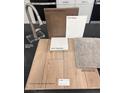 Sample of new home finishes: cabinets, paint, quartz, carpet, and luxury vinyl plank at 9918 Landings St, Las Vegas, NV 89141