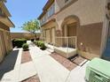 Well-maintained home exterior featuring stucco walls, manicured landscaping, and a private entrance at 10231 Delray Beach Ave # 201, Las Vegas, NV 89129