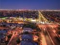 Nighttime aerial view showcasing the city lights and neighborhood layout at 10243 Aragon Crown Rd, Las Vegas, NV 89135
