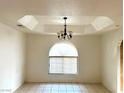 Traditional dining room with decorative ceiling detail and a vintage chandelier, bathed in natural light at 1409 Santa Margarita St # B, Las Vegas, NV 89146