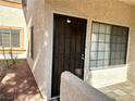 Property featuring a security door and a garden area adjacent to the front door entrance at 1409 Santa Margarita St # B, Las Vegas, NV 89146