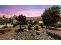 Charming home with drought-resistant landscaping including rock ground cover and desert plants at 2509 Big Timber Dr, Las Vegas, NV 89134